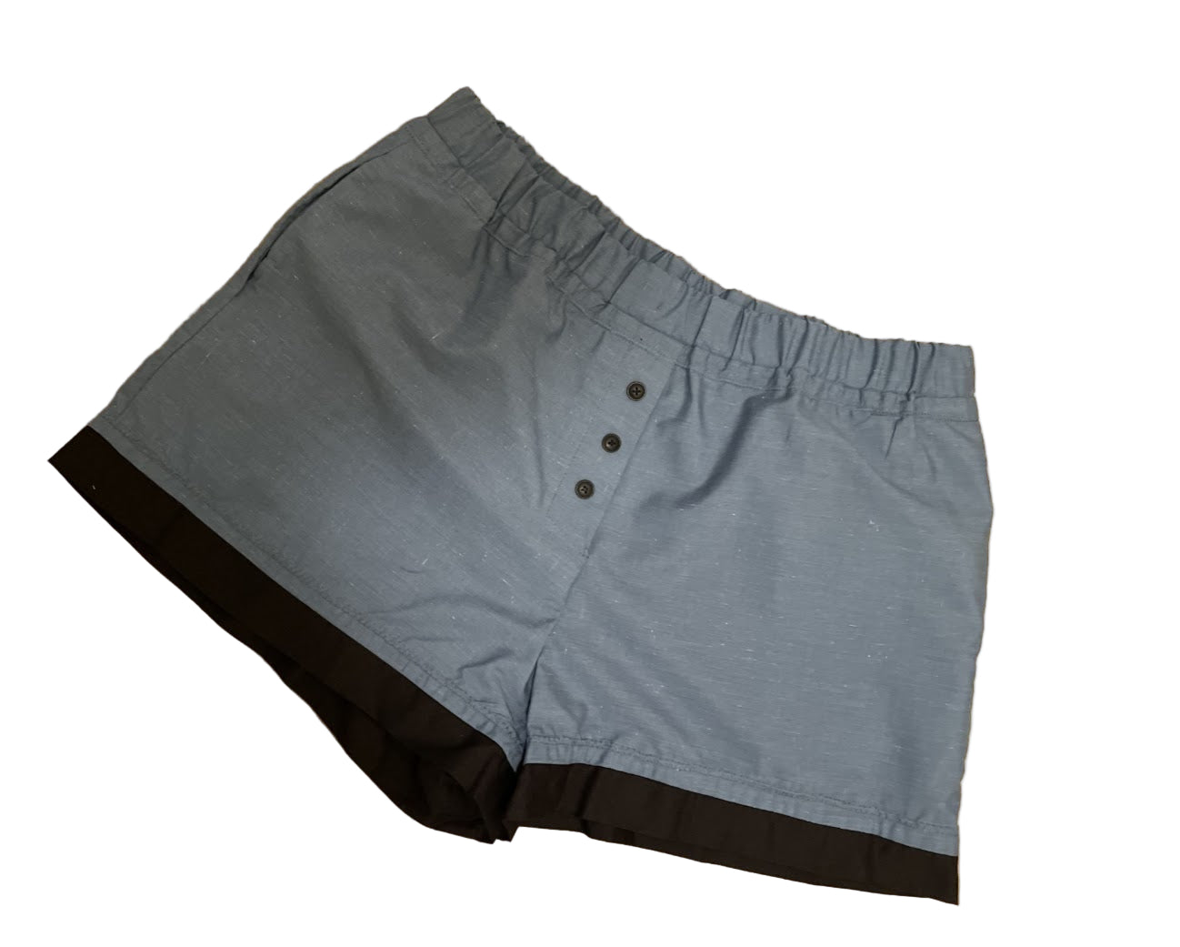 Women’s loungewear boxers in Blue Steel Lounge style, featuring a soft steel-blue body, black contrast hem, three-button front detail, deep side pockets, and a comfortable elastic waistband for a relaxed cozy fit.