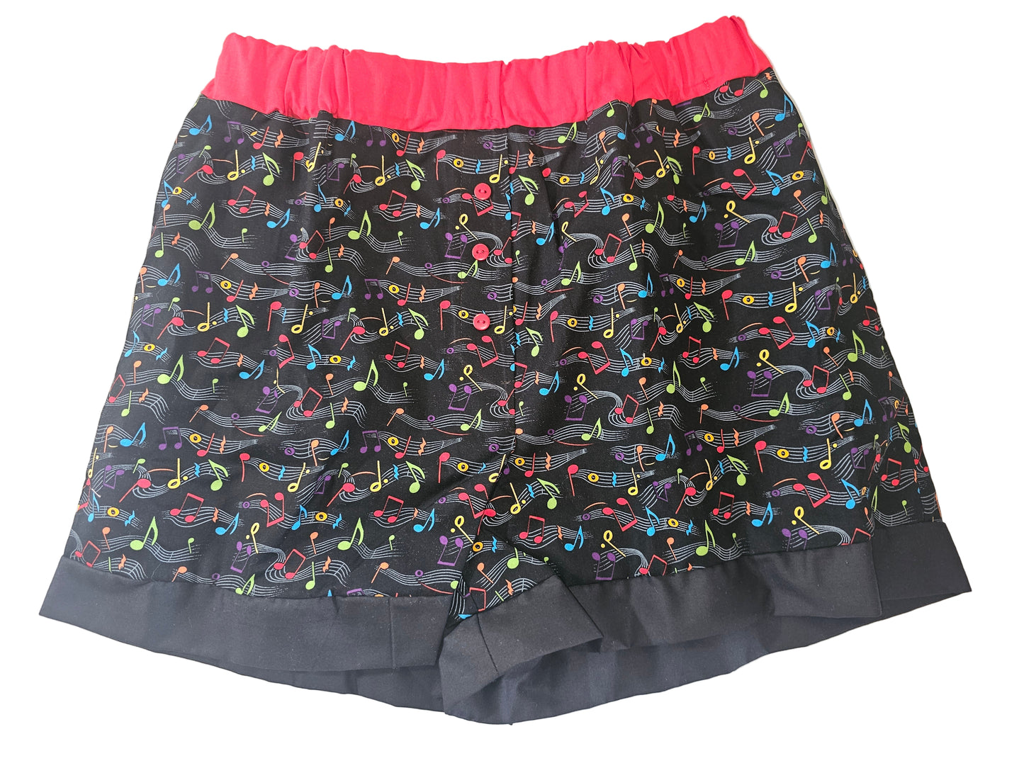 Black women’s loungewear boxers in ‘Do Re Mi Lounge ’ print, featuring colorful musical notes on a black background, red elastic leg bands, and deep pockets — handmade and comfy for music lovers.