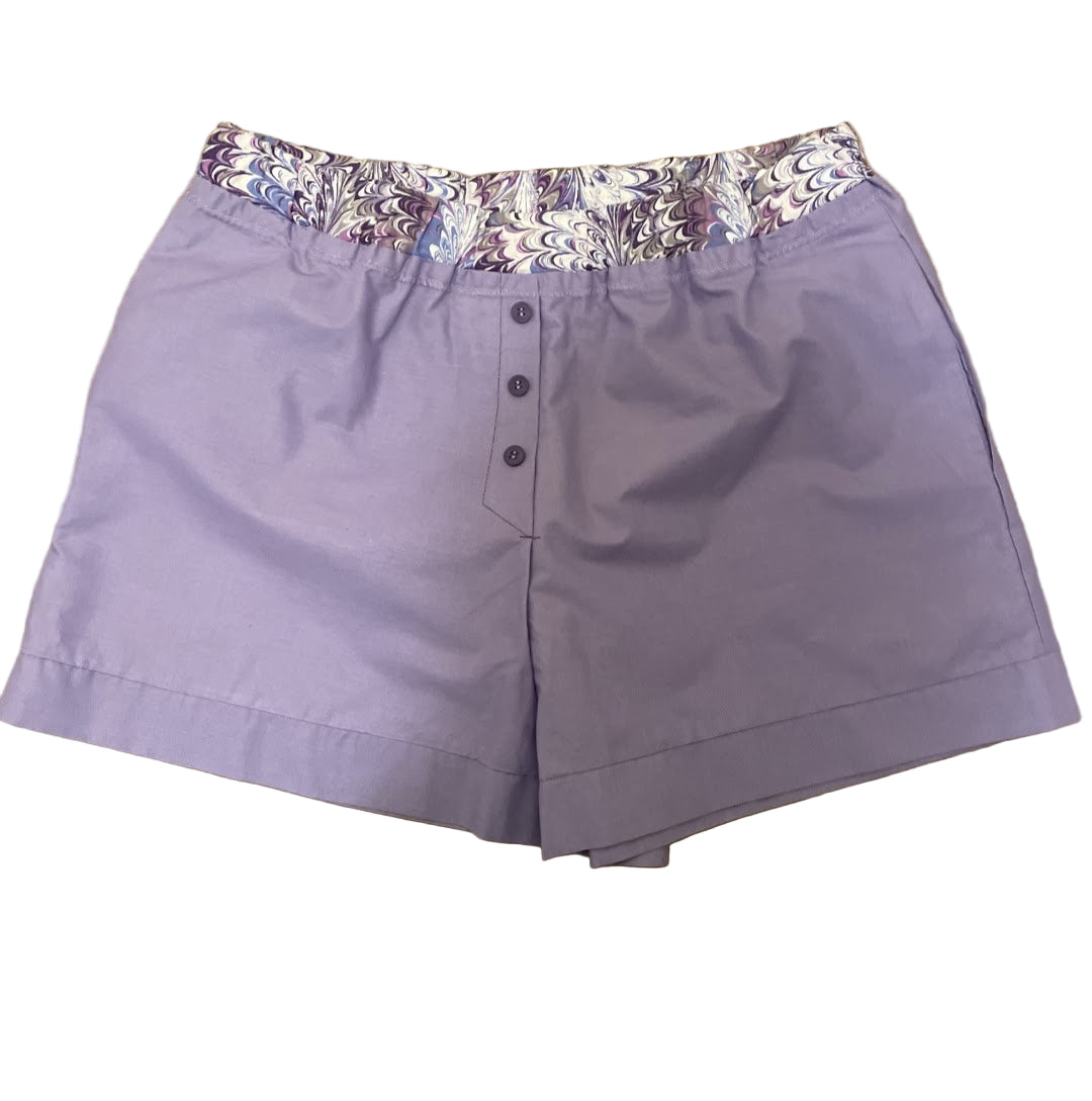 Purple women’s loungewear boxers in ‘Lavender Swirl Lounge’ style, featuring a marble-pattern waistband in lavender and plum tones, handmade with a relaxed fit and deep side pockets.