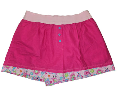 Pink women’s loungewear boxers in ‘Pinky the Owl Lounge’ print, featuring bright pink fabric with colorful owl trim, two-inch elastic waistband, light pink leg bands, and deep side pockets — handmade, comfortable fit.