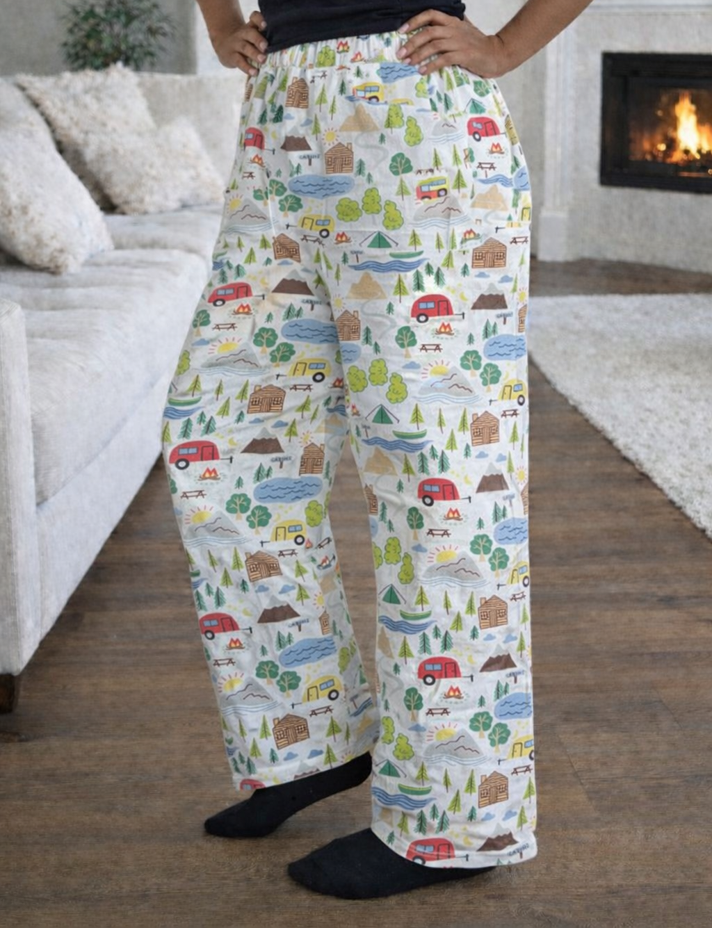 Women’s size large pajama pants with camping print featuring cabins, trees, trailers, lakes, and mountains, loose-fit lounge pants with elastic waist for sleepwear and cozy home wear.