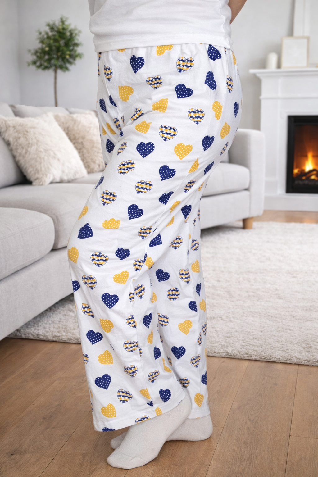 Women’s small heart-print pajama pants with relaxed fit, soft cotton fabric, and long draped legs for comfortable home wear