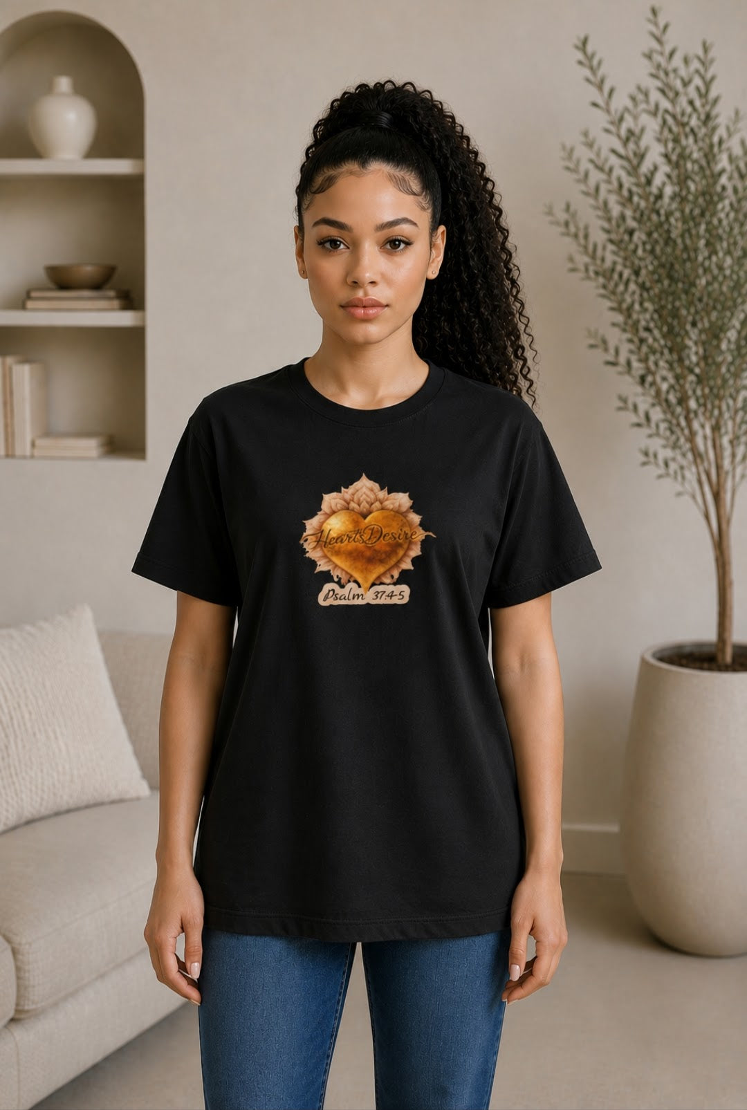 Woman wearing Large black unisex graphic t-shirt featuring Heart’s Desire heart artwork and Psalm 37:4-5 design.